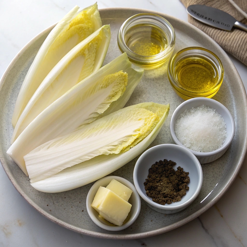Cuisson d’endives dans une poêle beurrée